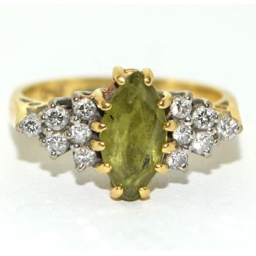 312 - 18ct gold ladies Peridot and Diamond ring set in a diamond shape size M