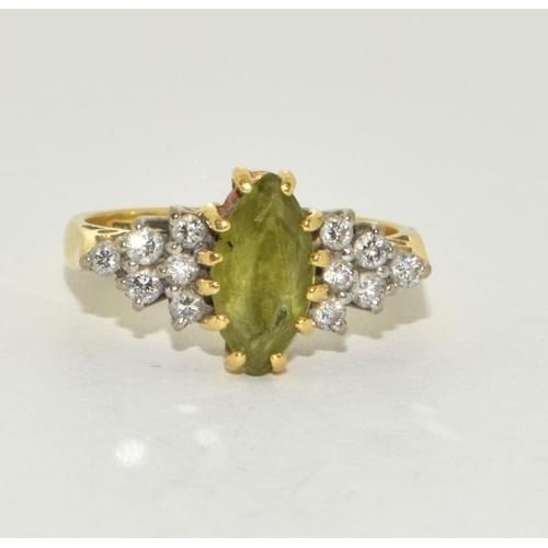 312 - 18ct gold ladies Peridot and Diamond ring set in a diamond shape size M