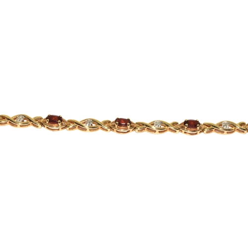 318 - 9ct gold Diamond and Garnet fancy twist bracelet 19cm long