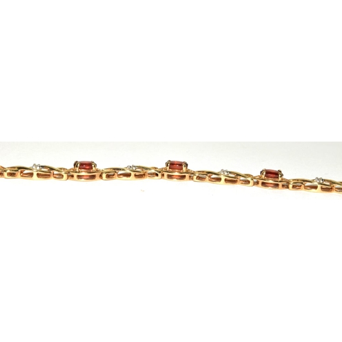 318 - 9ct gold Diamond and Garnet fancy twist bracelet 19cm long