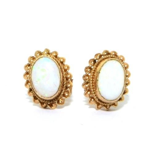 296 - 9ct gold Opal stud earrings