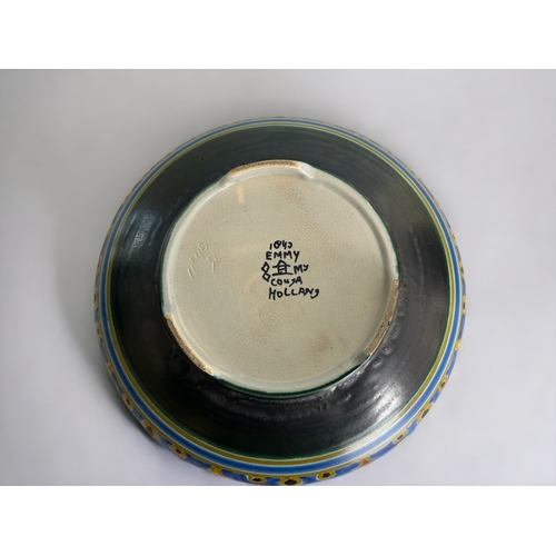 510 - A 1920's Gouda 'Emmy' bowl. Hand painted. Signed to base. Together with a 19th century glazed puzzle... 