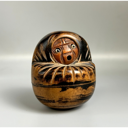 106 - A Japanese carved wooden Kobe Daruma doll dice holder. Late Meiji / Taisho period.Carved fruitwood f... 