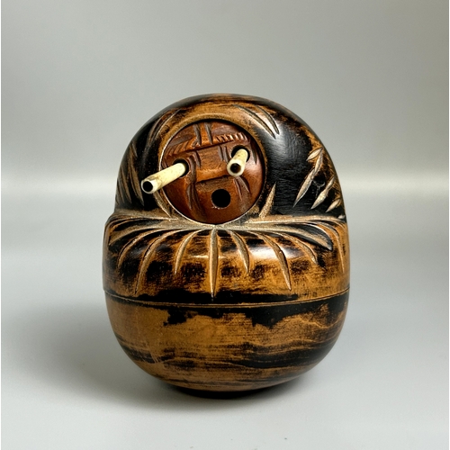 106 - A Japanese carved wooden Kobe Daruma doll dice holder. Late Meiji / Taisho period.Carved fruitwood f... 