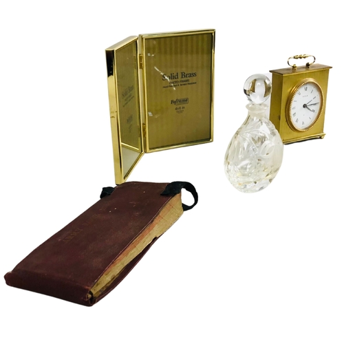 86 - A vintage brass wind up carriage clock, an antique medical note book and other collectibles