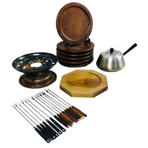 92 - Fondue set complete with burner and fondue forks, together with 6 hardwood plates.