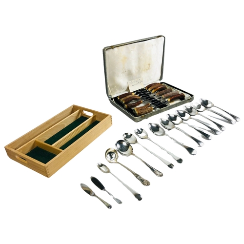 102 - A boxed set of 12 horn handled knives and forks together with various items of flatware and a cutler... 