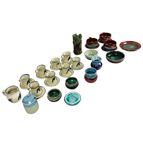 103 - Various items of Studio Pottery to include a set of 8 cups and saucers.