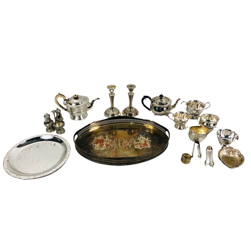 114 - Large assortment of silver plate items to include teapots, bowls and candlesticks.