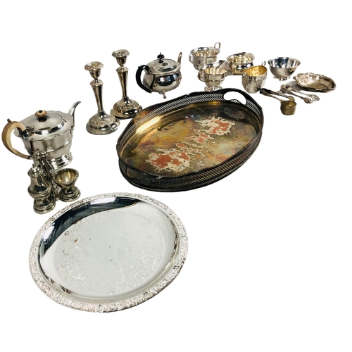 114 - Large assortment of silver plate items to include teapots, bowls and candlesticks.