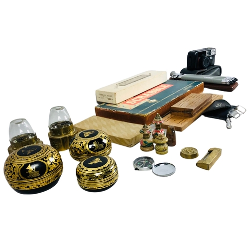 122 - Assortment of items to include 3 Thai lacquer lidded pot, various board games and a camera.