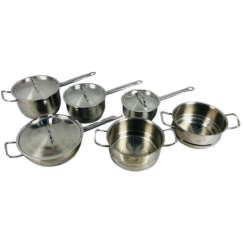 130 - A good set of stainless steel pans complete with steamer/strainer.