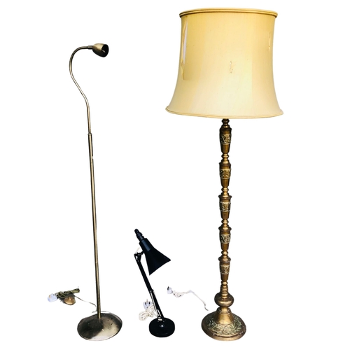 142 - Very heavy ornately decorated brass standard lamp and associated shade.  Together with 2 others, 1 a... 