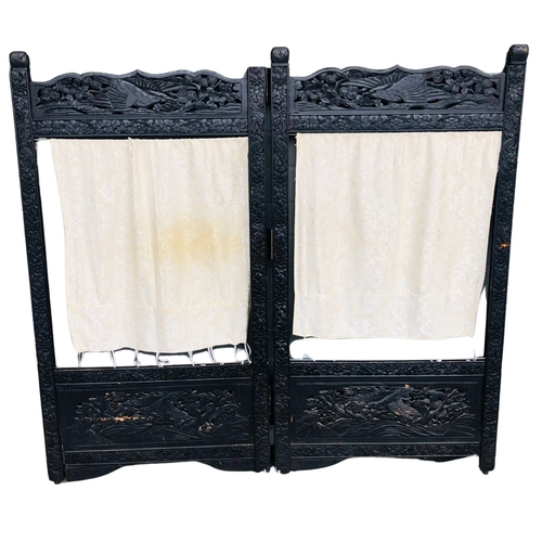 144 - Heavily carved vintage 2 panel screen in the oriental style.