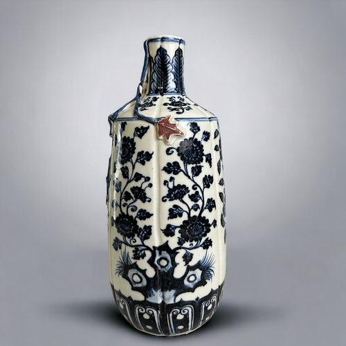 27 - A Chinese porcelain Ming style vase.20th Century. Heaped & piled cobalt design with applied leaf... 