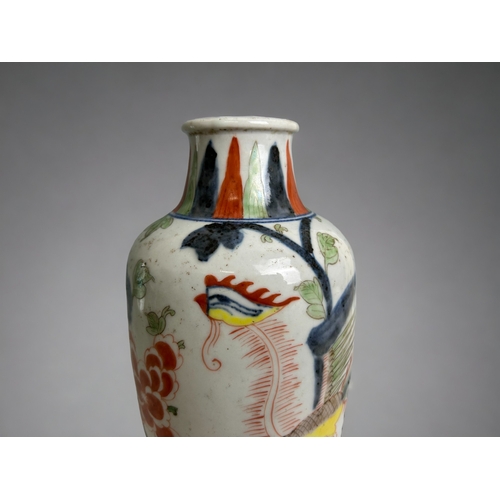 16 - A Chinese porcelain Wucai vase.Qing dynasty. Hand painted in Kangxi style, with a Phoenix amongst bl... 