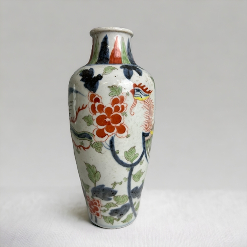 16 - A Chinese porcelain Wucai vase.Qing dynasty. Hand painted in Kangxi style, with a Phoenix amongst bl... 