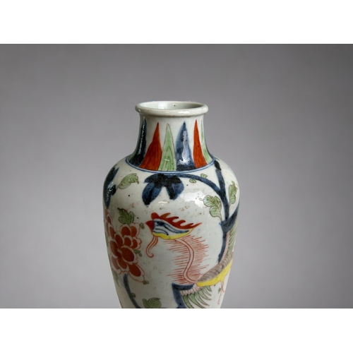 16 - A Chinese porcelain Wucai vase.Qing dynasty. Hand painted in Kangxi style, with a Phoenix amongst bl... 