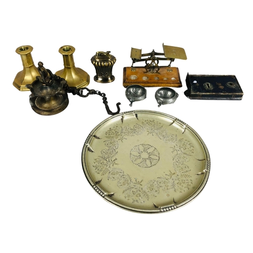 239 - Collection of Antique metal ware including a hanging bronze oil burner, brass dwarf candlesticks and... 