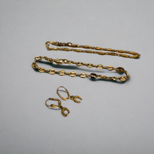 334 - A collection of gold plated necklaces, bracelets and pair of horseshoe earrings.