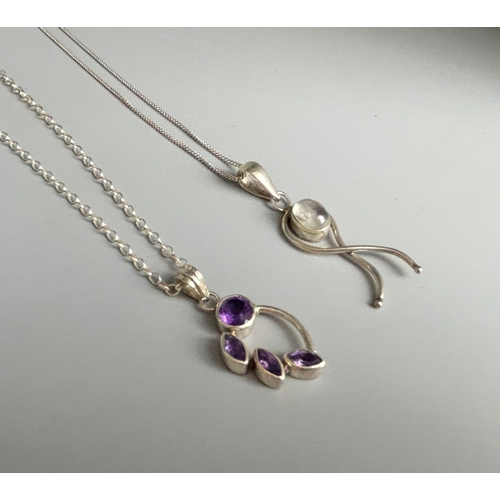 346 - Two ladies silver pendant necklaces.