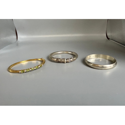 347 - Two ladies silver bangles, together with a gold plate stone set (possibly citrine) bracelet.