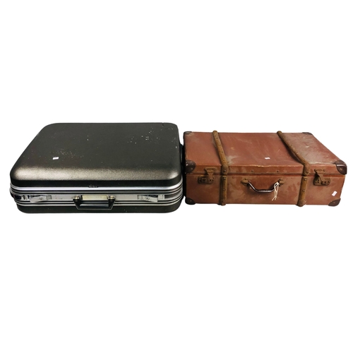 253 - Hard shell Delsey Suitcase together with a vintage suitcase.