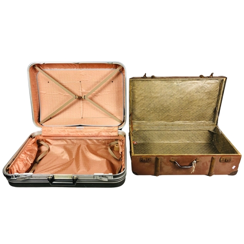 253 - Hard shell Delsey Suitcase together with a vintage suitcase.