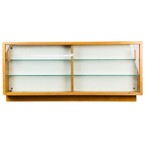 255 - Display Case with 4 glass shelves and two sliding doors.