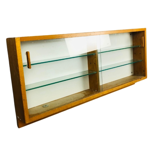 255 - Display Case with 4 glass shelves and two sliding doors.