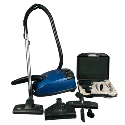 256 - Miele vacuum cleaner with attachments