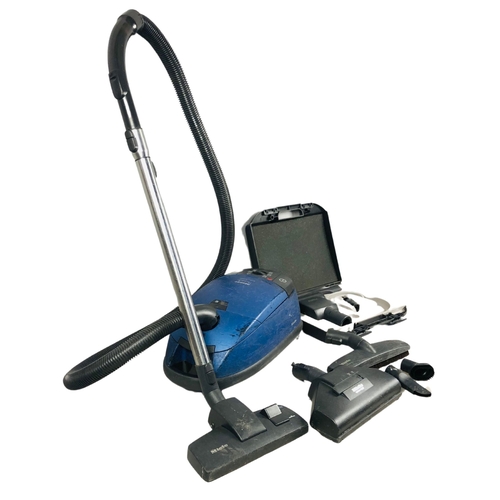 256 - Miele vacuum cleaner with attachments