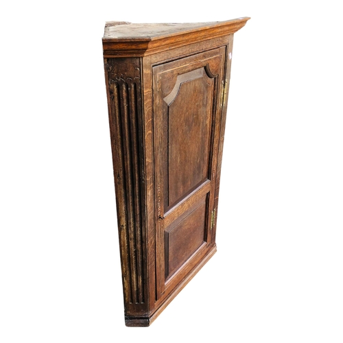 260 - Oak Corner Cabinet with two internal drawers and shaped edge shelves.