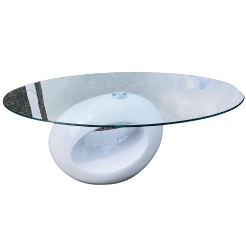 266 - Contemporary glass topped table in mid century manner. 110 wide x 44cm high