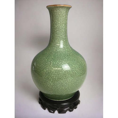 70 - Chinese Crackle Glazed Celadon Green Vase on later Stand.