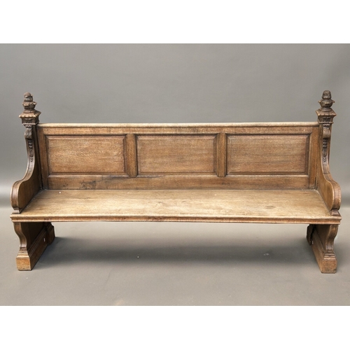 368 - Antique carved Oak church Pew.  Shaped armrests with curved finials.dimensions are 199 x 104 x 56cm... 