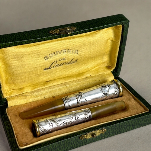 730 - A pair of antique French boxed 'Souvenir de Lourdes' his & hers Cheroot holders. Together with a... 