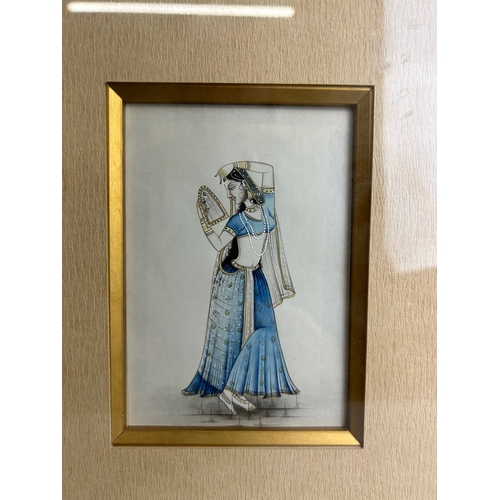 11 - A vintage Indian miniature painting.Depicting lady doing Shringar.