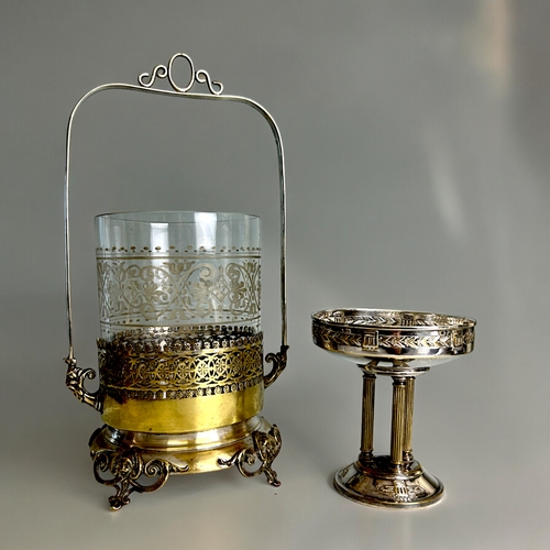 517 - A Victorian silver plate pickle castor. With etched glass liner. Together with a nickel plate on bra... 