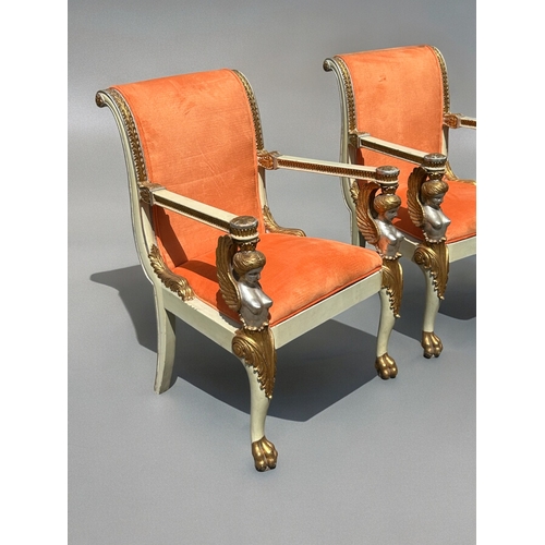 749 - A pair of Italian Neoclassical type armchairs.Early-mid 20th Century.Carved wood painted winged maid... 