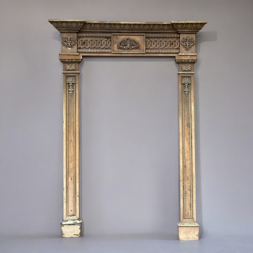 752 - A large antique carved wood Door surround / frame.Twin columns and header, with intricately carved o... 