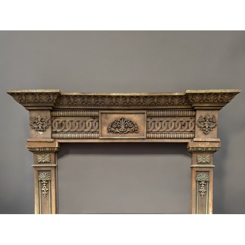 752 - A large antique carved wood Door surround / frame.Twin columns and header, with intricately carved o... 