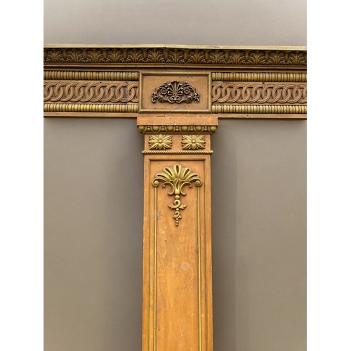 753 - A very large carved wood twin-door surround.Two outer columns with larger central divider. The heade... 