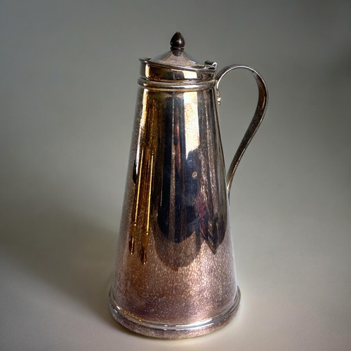 755 - William Arthur Benson,(British, 1854–1924).Arts & Crafts silver plate water jug, together with a... 