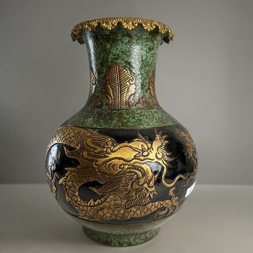 760 - A large Chinese bronze glazed pottery vase.Qianglong marked.Displaying two gilt dragons below leaf d... 