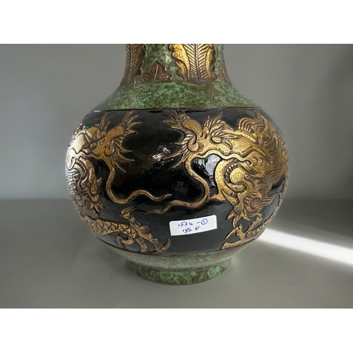 760 - A large Chinese bronze glazed pottery vase.Qianglong marked.Displaying two gilt dragons below leaf d... 