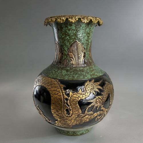 760 - A large Chinese bronze glazed pottery vase.Qianglong marked.Displaying two gilt dragons below leaf d... 