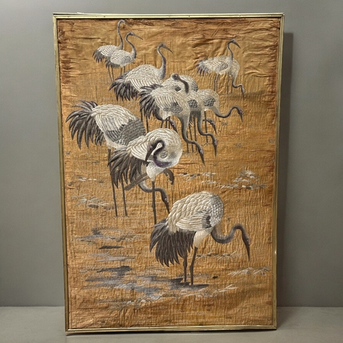 762 - A Large Chinese silk embroidery.Qing dynasty, 19th century.Depicting various Cranes in lake landscap... 