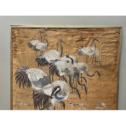 762 - A Large Chinese silk embroidery.Qing dynasty, 19th century.Depicting various Cranes in lake landscap... 