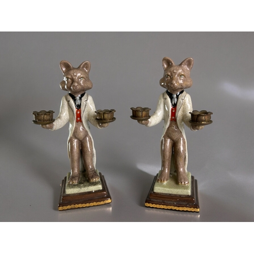 765 - A pair of hand painted porcelain 'Fox' candlesticks.With gilt metal holders.Height - 27cm... 